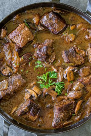 braised beef with mushrooms in a pot
