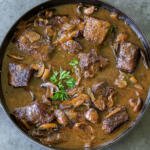 braised beef with mushrooms in a pot