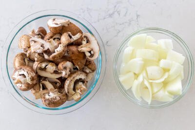 mushrooms and onion in two bowls