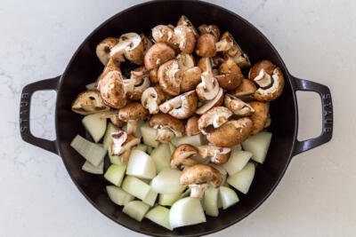 mushrooms and onion in a pan