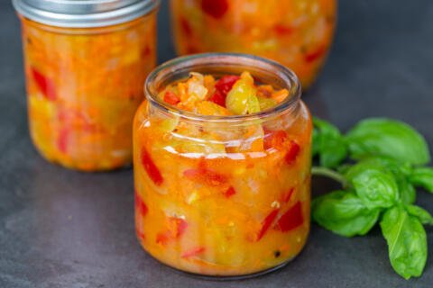 Canned green tomatoes in a jar