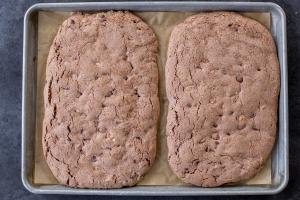 Baked biscotti log on a baking sheet