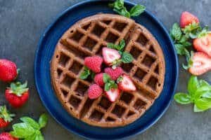 Chocolate waffles on a plate with berries