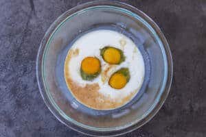 Eggs, milk and vanilla extract in a bowl