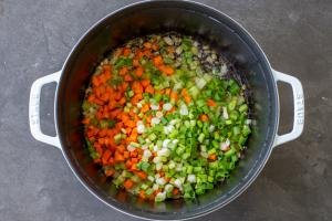 Veggies in a pot cooking.