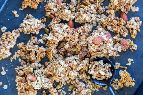 Baked Coconut Granola Clusters on a pan