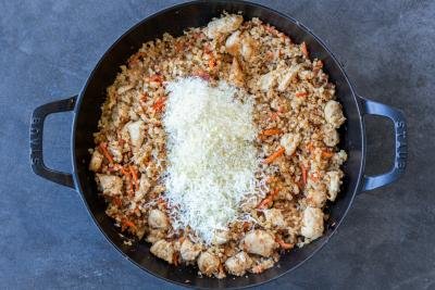 Cauliflower Rice chicken in a pan with cheese