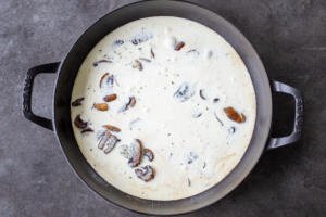 cream and mushrooms in a pan