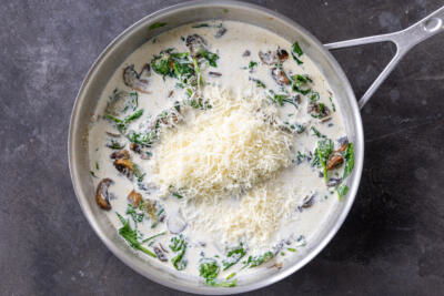 Creamy sauce with parmesan in a pan.