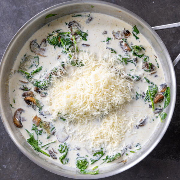Creamy sauce with parmesan in a pan.