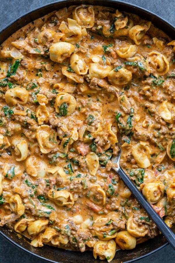 Creamy Spinach Tomato Tortellini in a pan