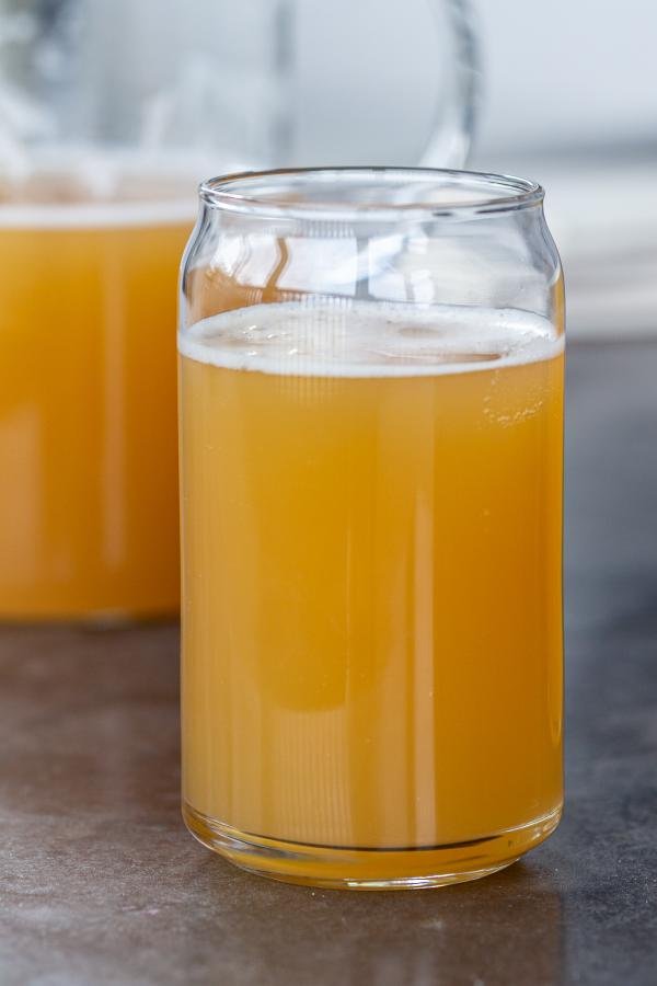 Kvass in a cup and a jar next to it