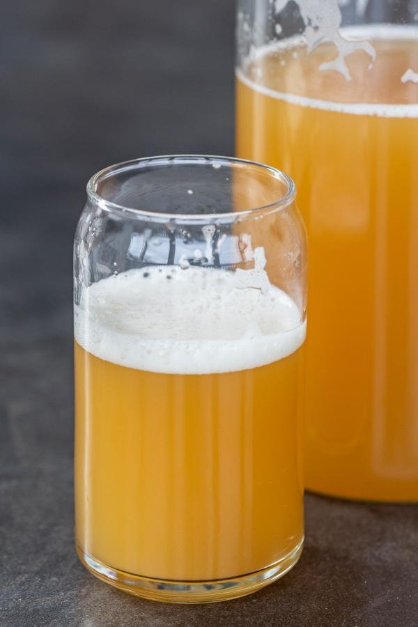 Kvass in a cup and a jar next to it