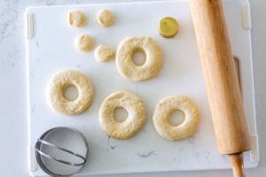 Cut out donut holes on a cutting board