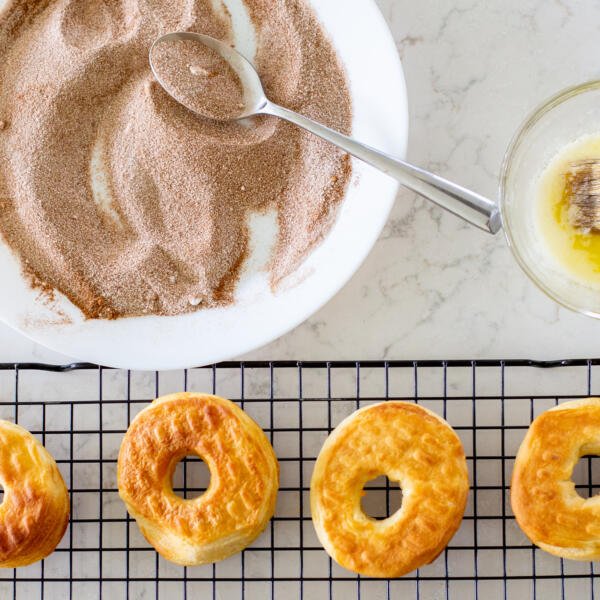 donuts, cinnamon sugar and butter on a counter