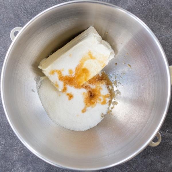 cream cheese and sugar in a mixing bowl
