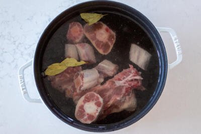 Broth with bones in a pot with water