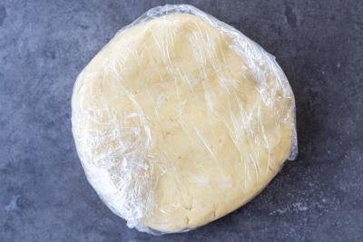 Wrapped dough in a plastic wrap