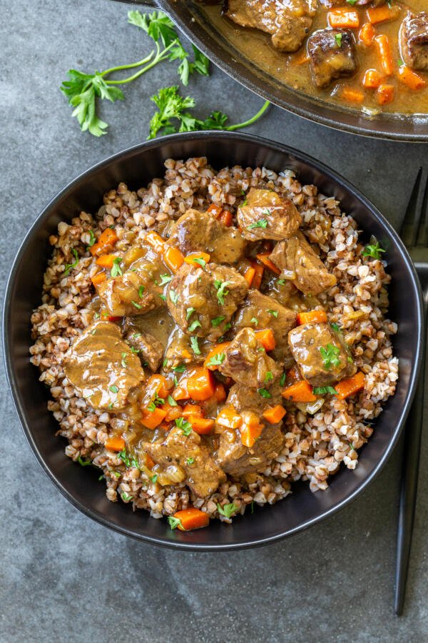 Beef stew gravy with buckwheat in a bowl