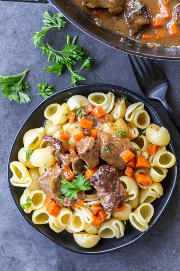 Beef Stew Gravy with noodles on a plate