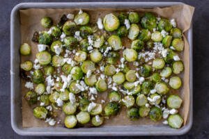 Oven-Roasted Brussels Sprouts with Garlic on a baking pan