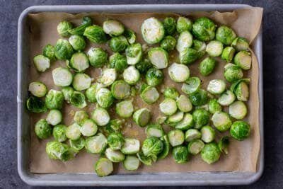 Seasoned Brussels Sprouts on a baking sheet