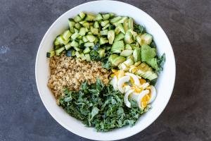 Quinoa Kale and Avocado Salad ingredients in a bowl