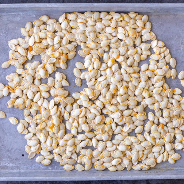 pumpkin seeds on a baking sheet