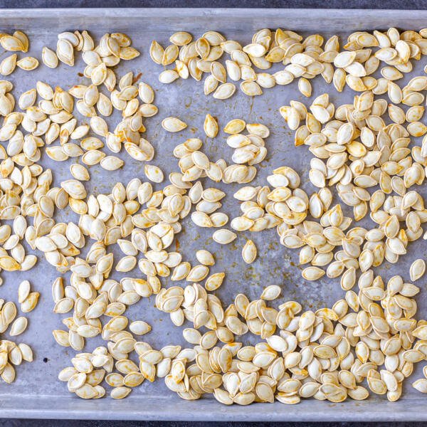 pumpkin seeds on a baking sheet