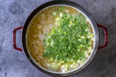 herbs and broth in a pot