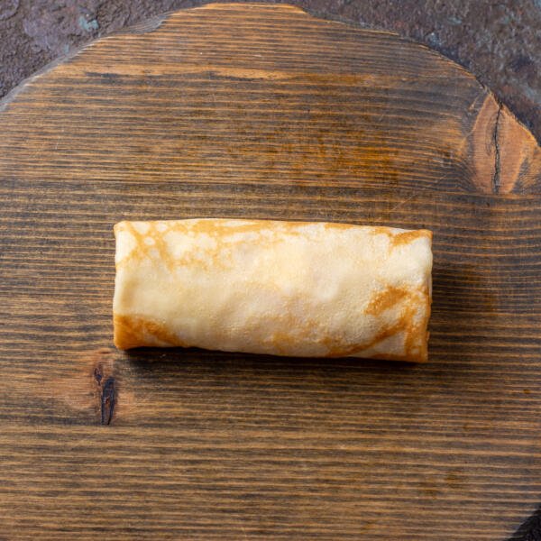 Blintzes with filling on a cutting board