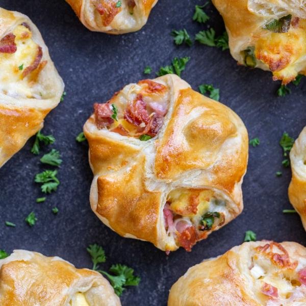 Freestyle Quiche on a serving tray with herbs.