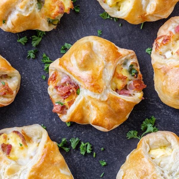 Freestyle Quiche on a serving tray with herbs.