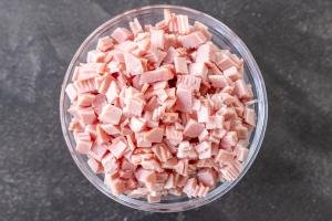 Ham cut into small pieces in a bowl.