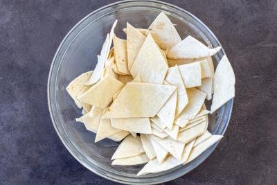 Cut up tortilla chips in a bowl
