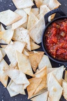 Baked chips in a serving tray with salsa