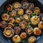Sautéed Mushrooms in a pan with herbs