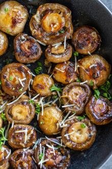 Sautéed Mushrooms in a pan with herbs