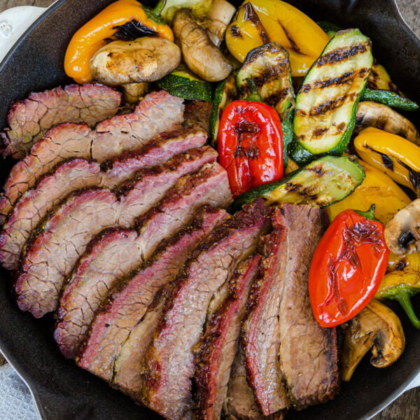 Beef brisket in a pan with veggies.