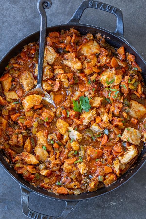 Baked cod with veggies in a pan