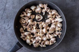 raw mushrooms in a pan