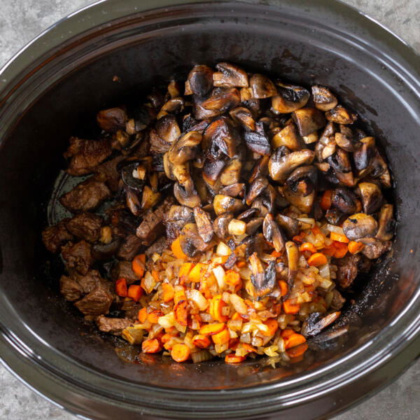 all the veggies with beef in a slow cooker