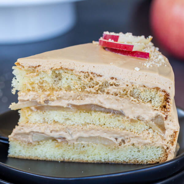 A slice of caramel apple cake on a plate.