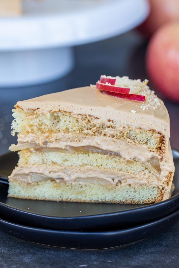 A slice of caramel apple cake on a plate.