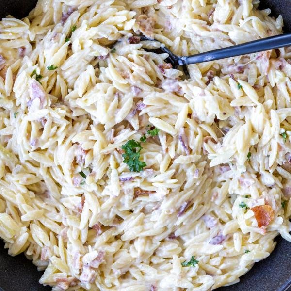 Creamy Orzo Bacon Pasta in a serving tray.