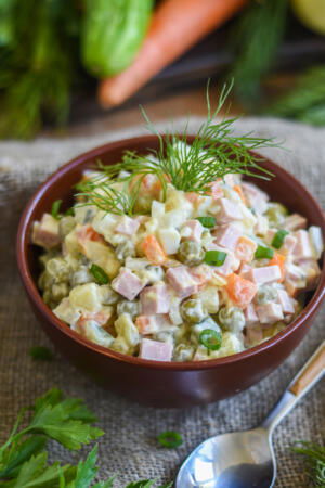 A bowl of Olivier Potato Salad.