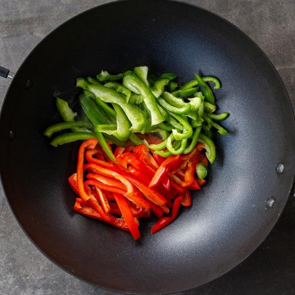 Pepper sliced in a wok