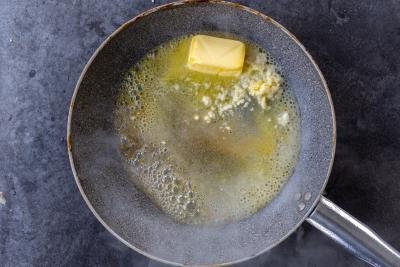 Butter, lemon and garlic in a pan