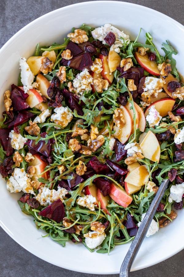 Beet and Goat Cheese Arugula Salad in a serving bowl 