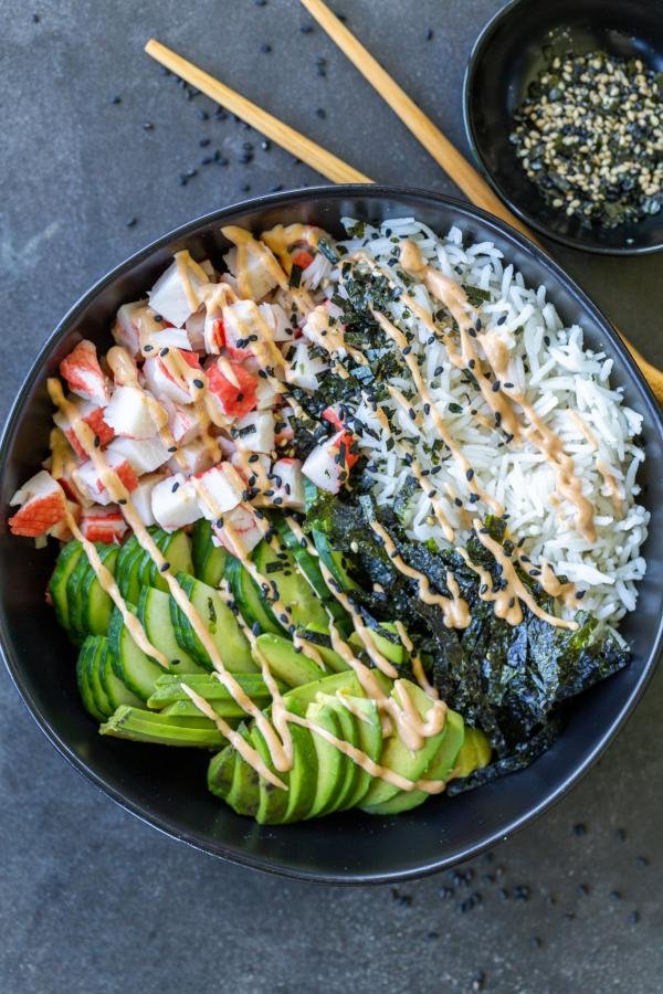 California Sushi Bowl with sauce and chop sticks.